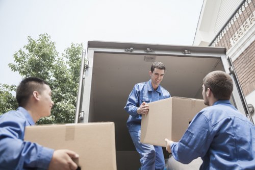 Local movers handling stairs in a Crystal Palace flat