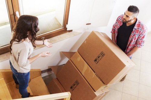 Local removals team navigating a Crystal Palace property staircase